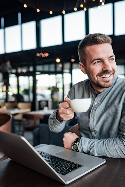 handsome-man-drinking-coffee-modern-cafe